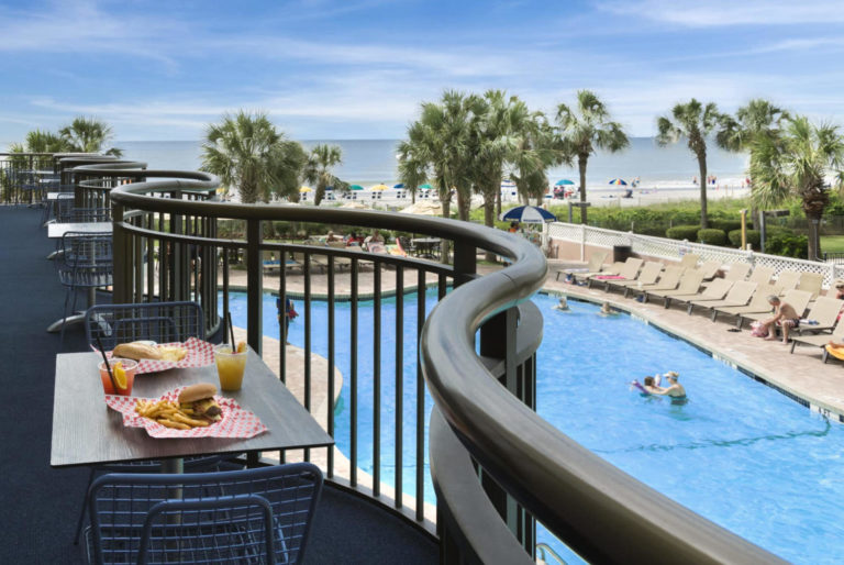 A on-site dining location overlooking the pool.