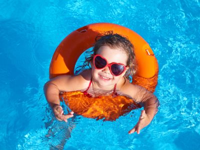 Little Girl in Floatie in Pool
