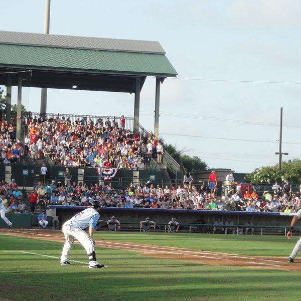 baseball players in middle of a game