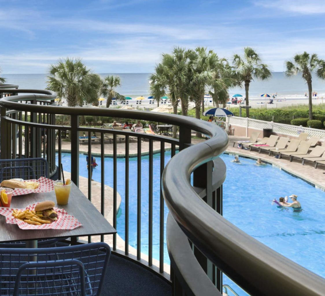 A on-site dining location overlooking the pool.